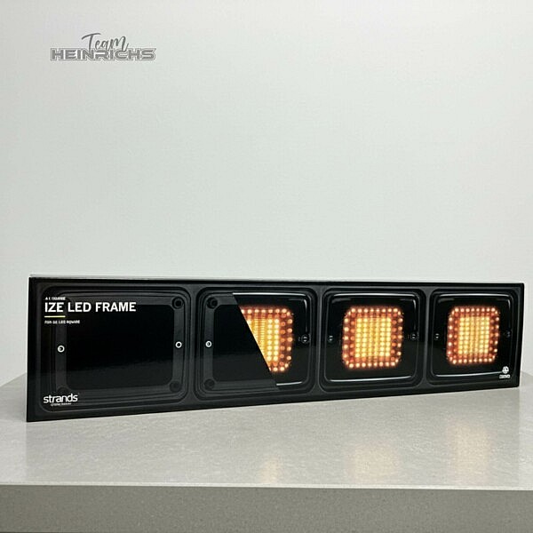 LED-Frame-LKW-Beleuchtung-Scheinwerferrahmen-strands-team-heinrichs.jpg Strands IZE LED Frame 4-fach mit amber LED-Modulen auf hellem Untergrund